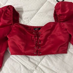 Long sleeve corset style crop top.